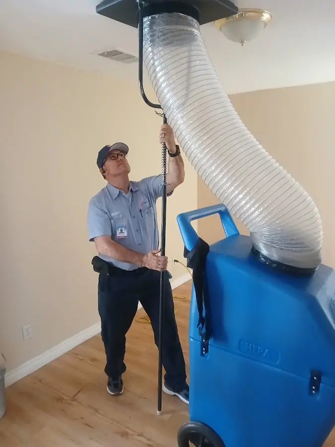 Furnace Tune-Up technician using HEPA equipment in Elmwood Park